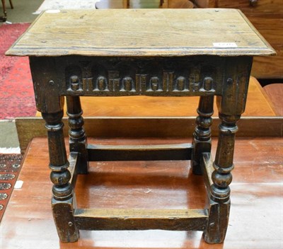 Lot 1276 - A 17th century oak joint stool with later top