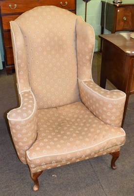 Lot 1291 - Queen Anne style armchair, probably 1920s, covered in gold coloured fabric