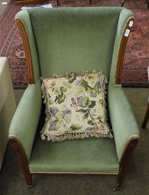 Lot 1303 - A late Victorian green upholstered armchair