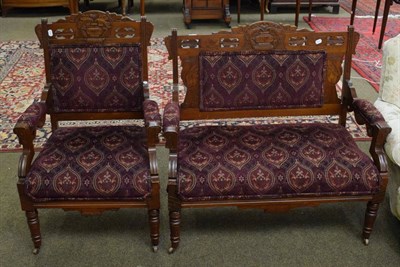 Lot 1316 - A late 19th century American walnut open armchair and a two-seater settee, of Arts and Crafts...