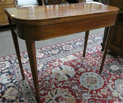 Lot 1320 - A 19th century mahogany and inlaid fold-over tea table