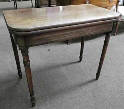 Lot 1321 - A 19th century mahogany fold-over tea table