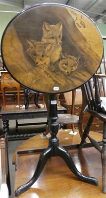 Lot 1326 - A 19th century ebonised tripod table decorated with three foxes