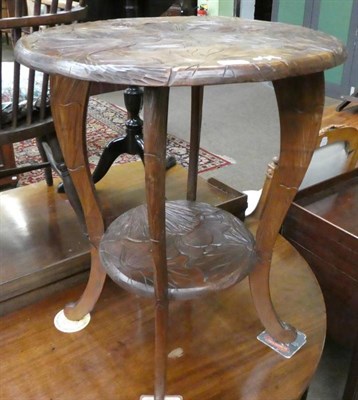 Lot 1335 - An early 20th century French carved occasional table, foliate design, two tiers