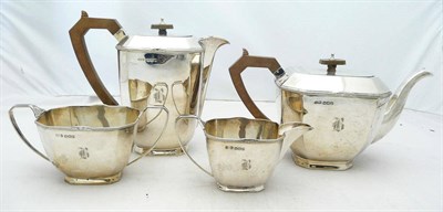 Lot 1076 - An Art Deco Four Piece Teaset, maker's mark S&W, Sheffield 1936, of canted rectangular form...