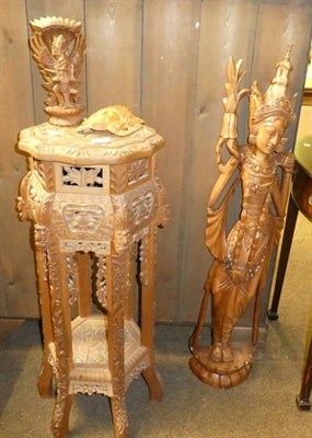 Lot 1347 - A Balinese heavily carved jardiniere stand together with three other carvings, 20th century (4)