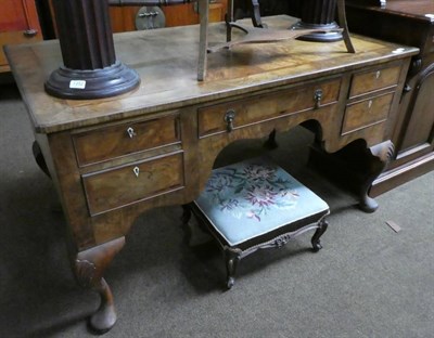 Lot 1350 - An oak lined walnut writing table in George I style