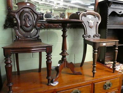 Lot 1358 - Two similar 19th century hall chairs and a Victorian mahogany tripod table (3)