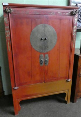 Lot 1360 - A Chinese style red lacquered two door cabinet