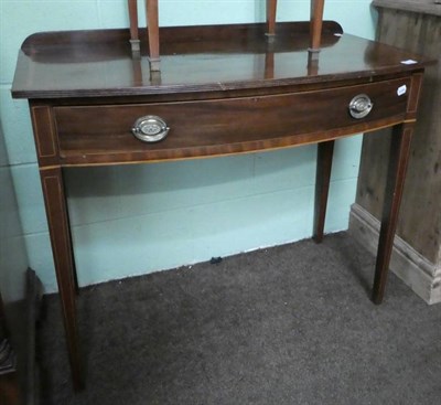 Lot 1363 - A late George III mahogany and inlaid bow fronted side table