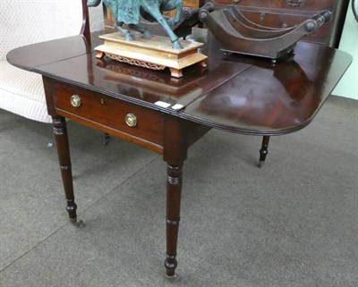 Lot 1371 - A Regency mahogany Pembroke table with reeded edge