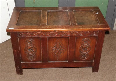 Lot 1392 - A 20th century carved oak blanket box