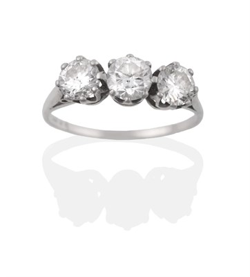 Lot 1 - A Diamond Three Stone Ring, three round brilliant cut diamonds in white claw settings, to a tapered