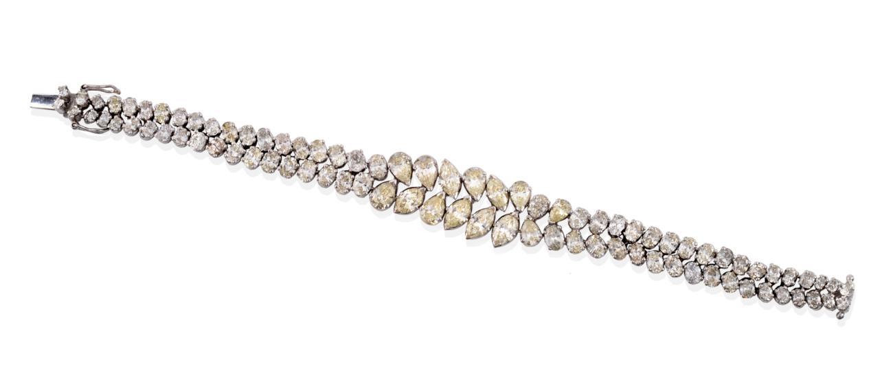 Lot 7 - A Diamond Bracelet, of two rows comprised of marquise cut, pear cut and oval cut diamonds in...
