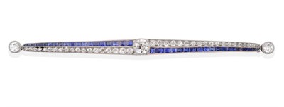 Lot 9 - An Art Deco Sapphire and Diamond Bar Brooch, with an old cut diamond centrally within tapered...