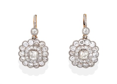 Lot 13 - A Pair of Diamond Drop Cluster Earrings, an old cut diamond in a millegrain setting suspends a...