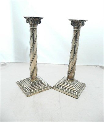 Lot 1084 - A Pair of Edward VII Candlesticks, William Hutton & Sons Ltd, London 1901, stepped square bases...