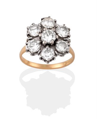 Lot 26 - An 18 Carat Gold Diamond Cluster Ring, seven round brilliant cut diamonds in white claw...