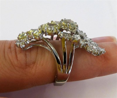 Lot 42 - An Abstract Diamond Cluster Ring, the cluster forming an almost crescent shape set with various...