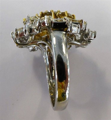 Lot 43 - An Abstract Diamond Cluster Ring, the cluster forming an almost floral shape set with various...