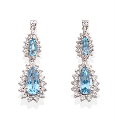 Lot 44 - A Pair of 18 Carat White Gold Aquamarine and Diamond Drop Earrings, a round brilliant cut...