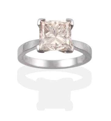 Lot 45 - A Platinum Diamond Solitaire Ring, the princess cut diamond in a four claw setting to knife...