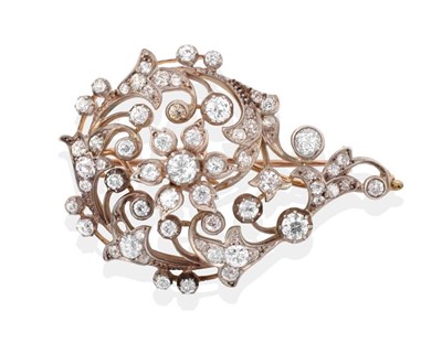 Lot 58 - A Late 19th Century Diamond Brooch, old cut diamonds create a floral centre within a swirling...
