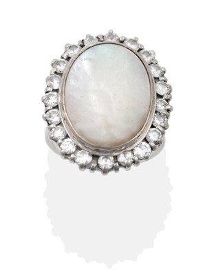 Lot 59 - A Mother-of-Pearl and Diamond Cocktail Ring, the flat mother-of-pearl in a white collet...
