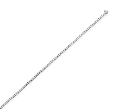 Lot 60 - An 18 Carat White Gold Diamond Line Bracelet, round brilliant cut diamonds in claw settings,...