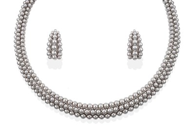 Lot 65 - A ''Grains de Raisins'' Necklace and Earring Suite, by Boucheron, comprising three rows of...