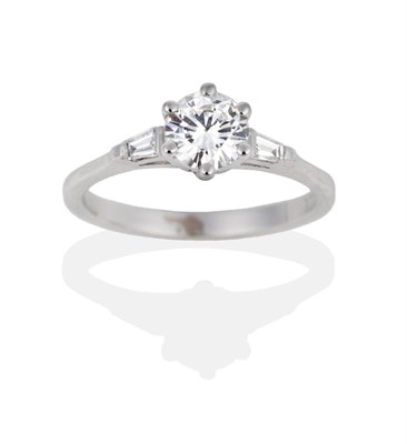 Lot 73 - An 18 Carat White Gold Diamond Solitaire Ring, the round brilliant cut diamond in a claw setting to