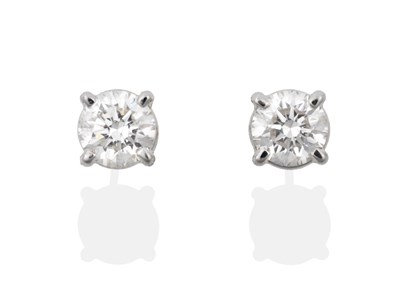 Lot 90 - A Pair of 18 Carat Gold Diamond Solitaire Earrings, the round brilliant cut diamonds in white claws