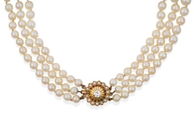 Lot 91 - A Three Strand Cultured Pearl Necklace, with a Diamond and Seed Pearl Clasp, the 57:61:63...