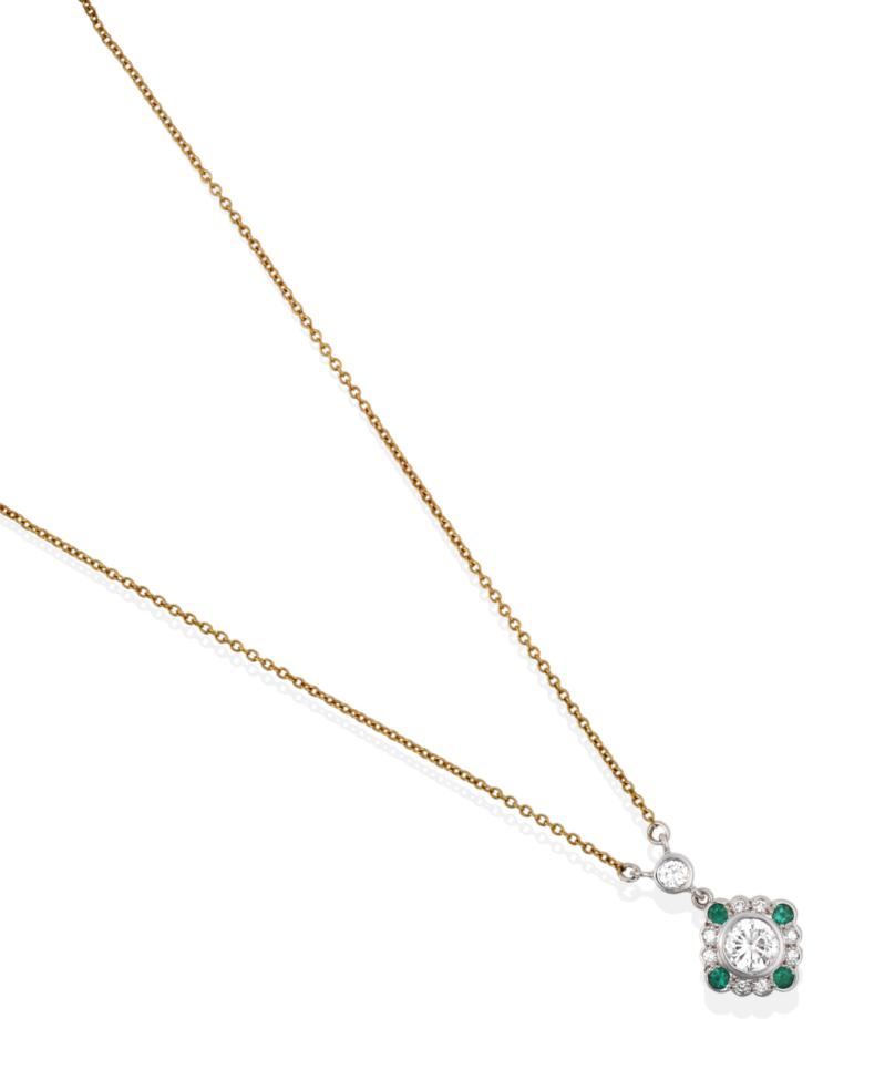 Lot 92 - A Diamond and Emerald Pendant Necklace, the drop comprised of a round brilliant cut diamond...