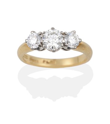 Lot 95 - An 18 Carat Gold Diamond Three Stone Ring, the round brilliant cut diamonds in white claws on a...