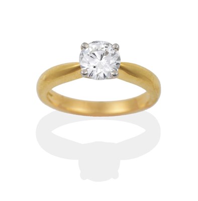 Lot 97 - An 18 Carat Gold Diamond Solitaire Ring, the round brilliant cut diamond in a white four claw...