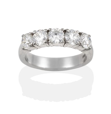 Lot 111 - A Platinum Diamond Five Stone Ring, the round brilliant cut diamonds in claw settings, on a...