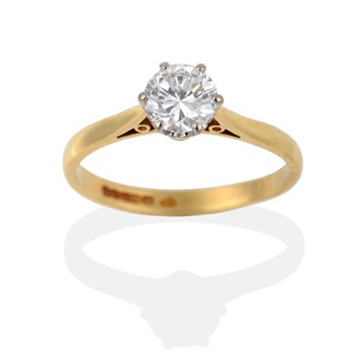 Lot 115 - An 18 Carat Gold Diamond Solitaire Ring, the round brilliant cut diamond in a white six claw...