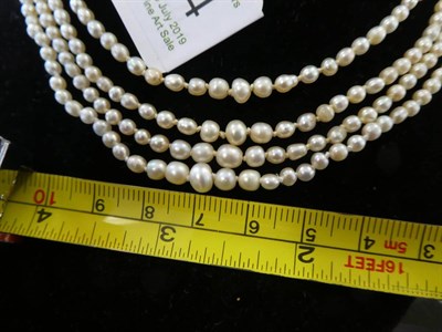 Lot 124 - A Four Row Pearl Necklace, the off-round 101:105:114:120 pearls strung to a lozenge shaped...