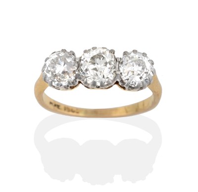 Lot 131 - A Diamond Three Stone Ring, three old cut diamonds in white claw settings, to a yellow tapered...