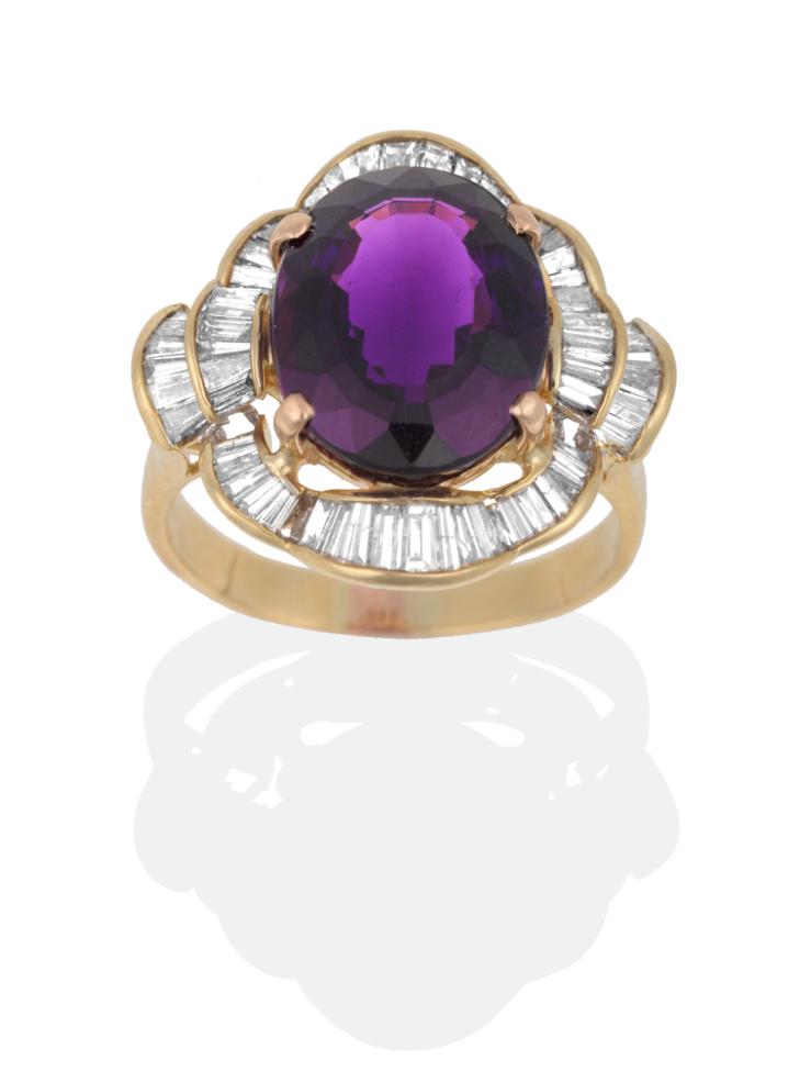 Lot 141 - An Amethyst and Diamond Cluster Ring, an oval mixed cut amethyst in a yellow four claw setting,...