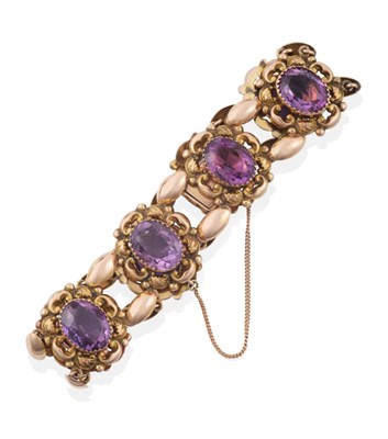 Lot 142 - An Early 20th Century Amethyst Bracelet, comprised of eight panels each with an oval cut...