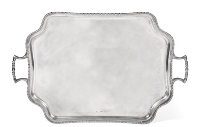 Lot 146 - A Twin-Handled Silver Tray, Atkin Bros, Sheffield 1910, shaped rectangular with beaded rim, on four