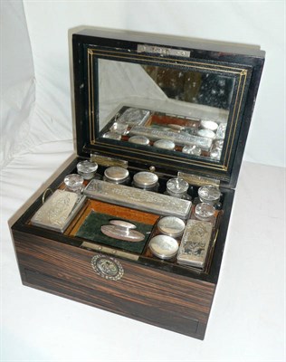 Lot 1109 - A Victorian Coromandel Dressing Table Box, circa 1850, fitted with twelve plated bottles and boxes