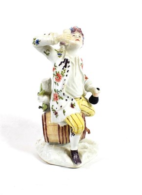 Lot 509 - A Bow Porcelain Figure of a Toper, circa 1755, seated astride a barrel holding a bottle, on a...