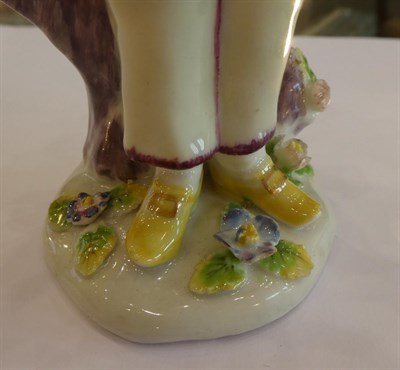 Lot 511 - A Bow Porcelain Commedia dell'Arte Figure of Pierrot, circa 1760, standing wearing a pink hat...