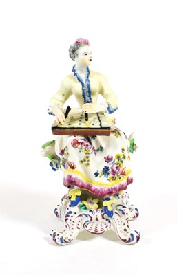 Lot 513 - A Bow Porcelain Figure of a Musician, circa 1765, seated playing the zither, on a scroll...