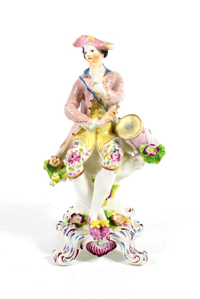 Lot 517 - A Bow Porcelain Figure of a Drummer, circa 1765, modelled seated, his drum at his side, on a...