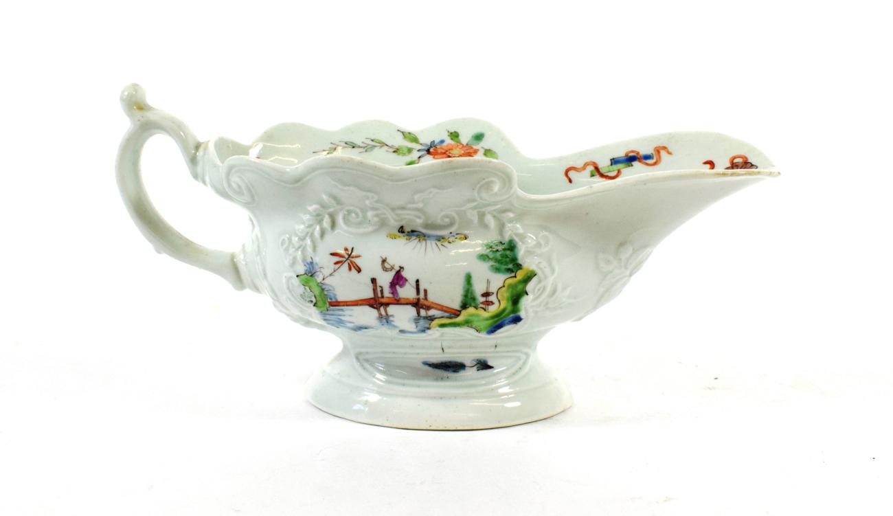 Lot 525 - A Worcester Porcelain Silver Shaped Sauceboat, circa 1755, painted famille verte type enamels...