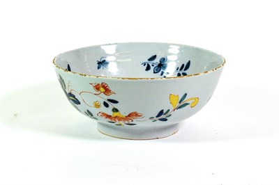 Lot 531 - An English Delft Bowl, circa 1750, painted in colours with a chinoiserie figure in a lattice...